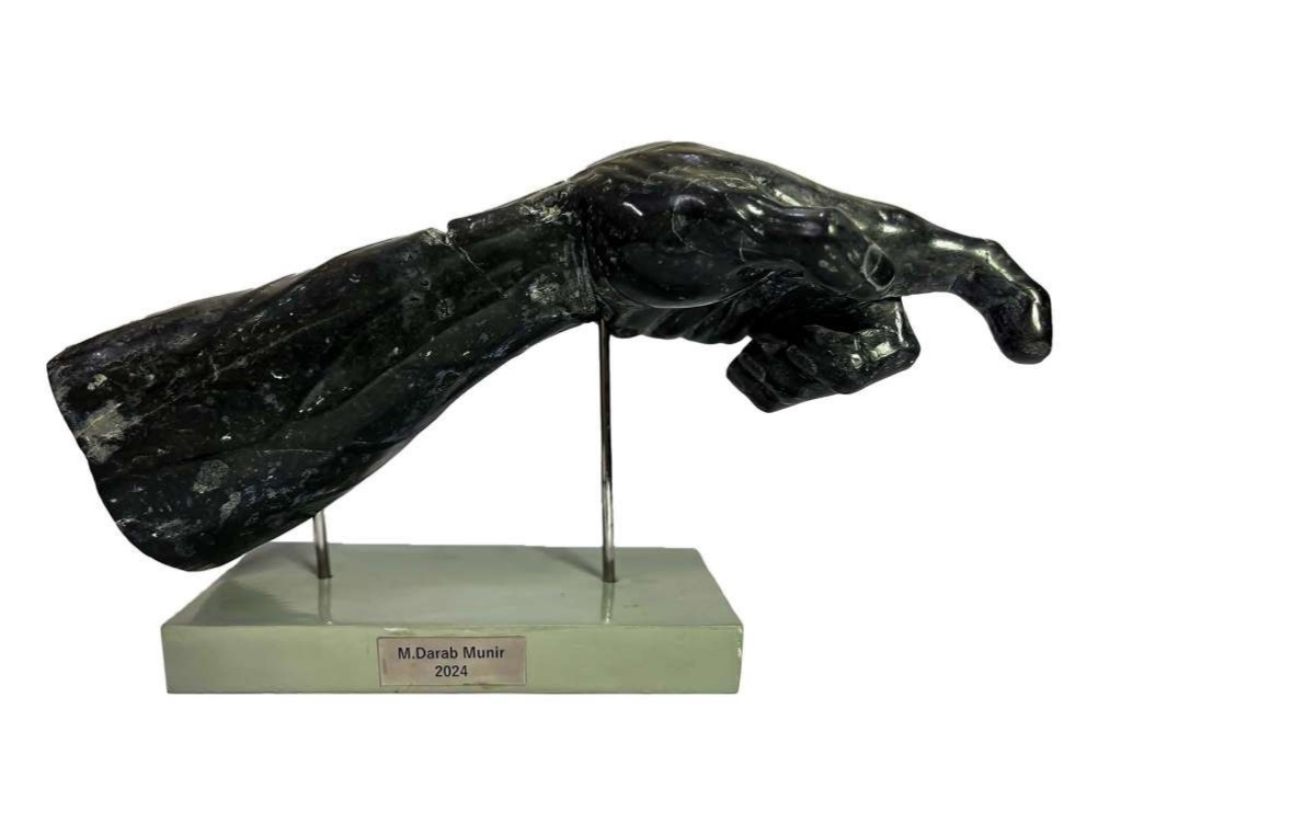 Artist: Darab Munir<br/>Title: "Reflection II" <br> Medium: Black Jet Marble<br>Size: 18x11.5x8<br>Year: 2024